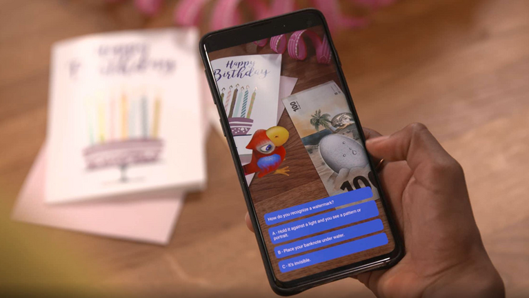 Illustration of banknote app for kids with penny the parrot on mobile phone